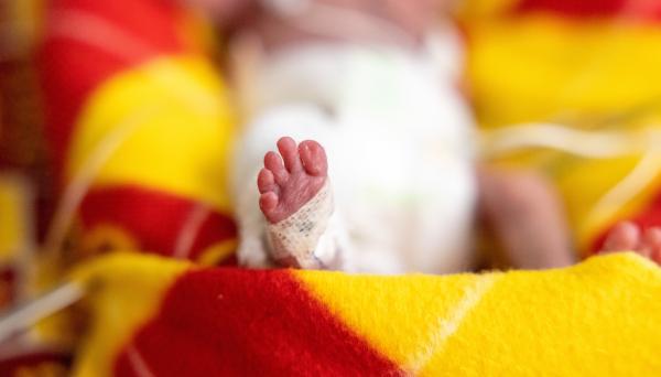 Tiny foot of a baby in the NICU